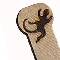 Gecko burned into wooden scoop. Lizard